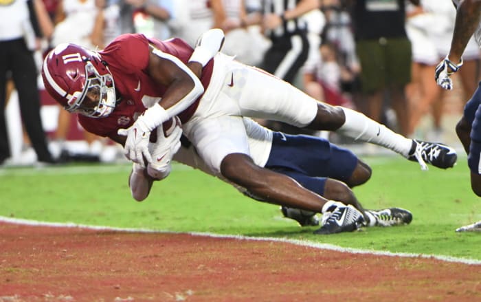 Traeshon Holden hauls in a touchdown pass against the Utah State Aggies.
